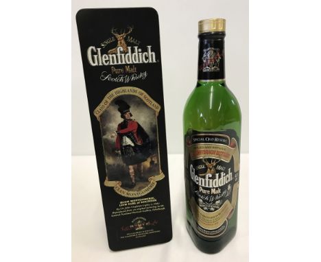 A 70cl bottle of Glenfiddich single malt Scotch whisky. In a Clan Montgomerie presentation tin from a series "Clans of the Hi
