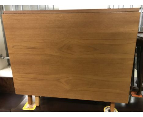 A vintage teak drop leaf gate leg table.  Approx. 81 x 41cm in fold down position. Height approx. 72cm.