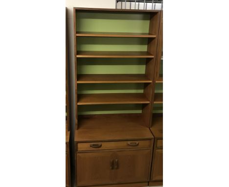 A vintage teak display unit in 2 parts. 2 door cupboard with interior shelf under large drawer with cutlery compartment. Top 