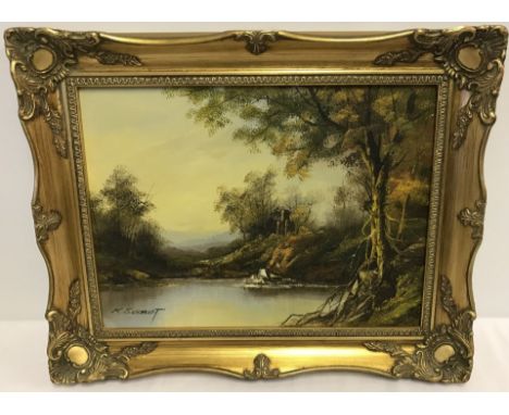 A gilt framed oil on canvas of a river scene. Signed to lower left, K. Schmidt. Approx. 29 x 39cm.
