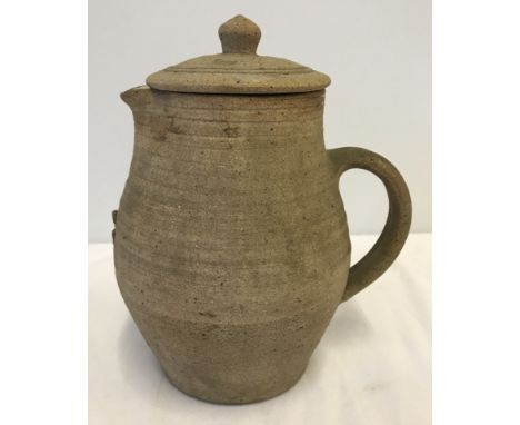 A Bernard Leach, St Ives studio pottery lidded jug with green glaze interior.  Approx. 19cm tall.