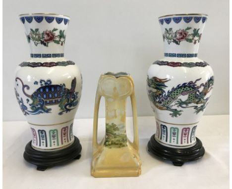 2 oriental design vases by The Franklin Mint Porcelain. The Dance of the Celestial Dragon (tiny crack to rim) & The Journey o