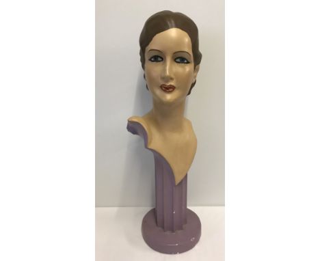 A painted plaster mannequin head display stand.  Approx. 68cm tall.