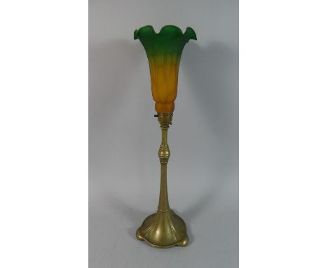 An Art Nouveau Brass Lamp with Tiffany Style Glass Shade. Base 33cms High