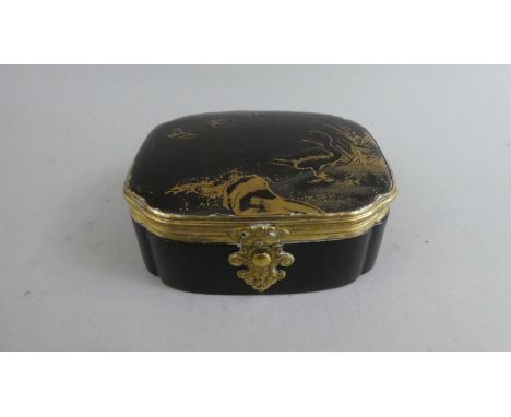 An Oriental Gilt Decorated Lacquered Box with Push Button Catch. The Hinged Lid Decorated with Three Flying Ducks and Standin