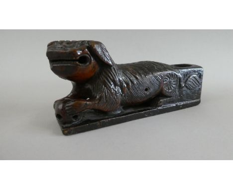 An Interesting Early Chinese Carved Wooden Study of Reclining Lion with Ball in Mouth and Paw on Pierced Globe. Rear Pen Wipe