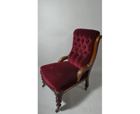 A 19th Century Red Velvet Button Backed and Upholstered Ladies Nursing Chair. on Turned Front Legs Culminating in Castors.&nb