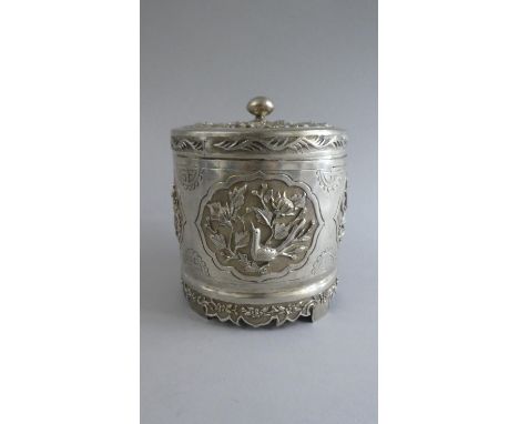 A Cylindrical Chinese Silver Pot Pourri Box with High Relief Cartouches decoration to Body depicting Birds and Dragons. Pierc