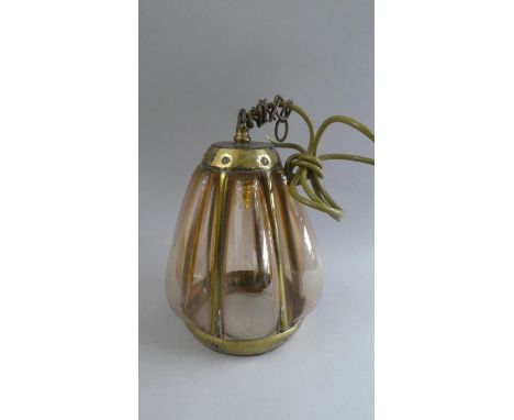 An Early 20th Century Arts and Crafts Hall Lantern with a Riveted Brass Frame and Globular Amber Glass Panels. 18x28cms High