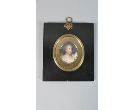 A Framed Oval Porcelain Miniature Portrait of a Girl. Frame 13x11.5cms 
