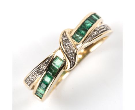 A modern 9ct gold emerald and diamond crossover ring, setting height 5.9mm, size J, 2gNo damage or repairs, all stones presen