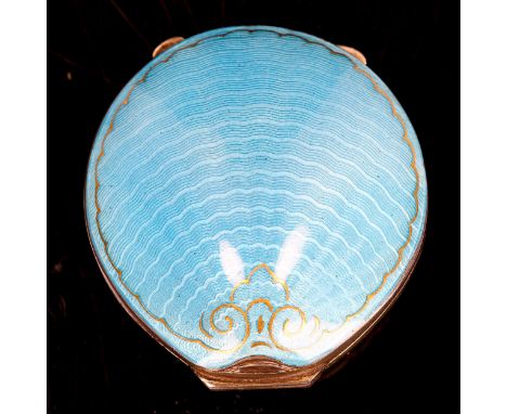 A miniature Continental silver and blue enamel shell compact, engine turned guilloche decoration with hand gilded border and 