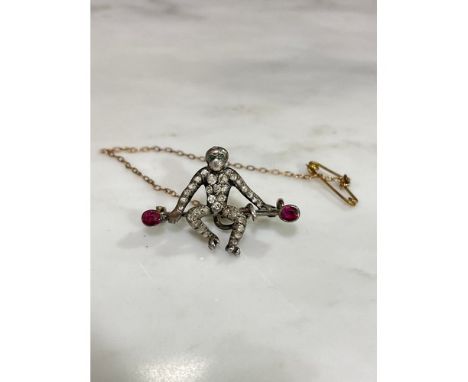 A Victorian novelty figural gem set monkey brooch, gemstones include ruby emerald and diamond, unmarked silver and gold setti