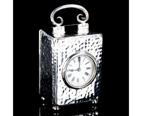 An Edwardian silver-cased carriage clock, by William Comyns, hallmarks London 1903, case height excluding handle 8cm, working