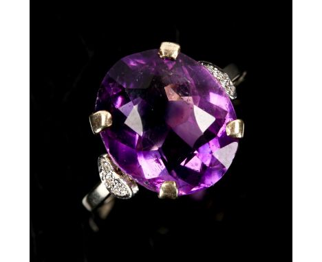 A Vintage 18ct white gold amethyst dress ring, set with oval mixed-cut amethyst and single-cut diamond shoulders, amethyst le