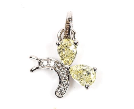 A modern 18ct white gold fancy yellow diamond and diamond figural butterfly pendant, set with pear brilliant and modern round