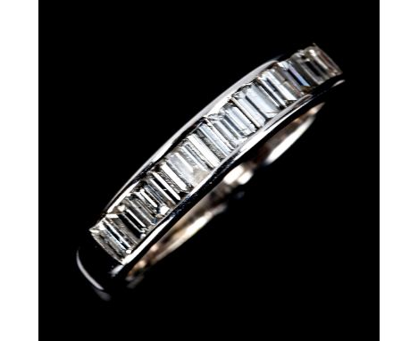 A modern diamond half eternity ring, unmarked white gold settings test as 18ct, set with baguette-cut diamonds, total diamond