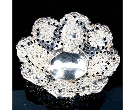 A late Victorian silver bon bon dish, relief embossed and foliate decoration, by James Deakin & Sons, hallmarks Chester 1897,