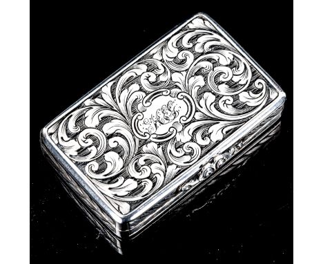 A Victorian silver vinaigrette, rectangular form with allover engraved foliate decoration, pierced and engraved floral grille