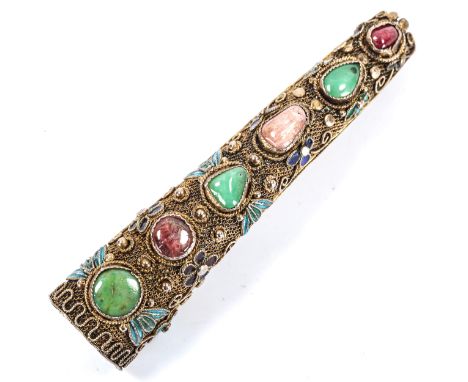 An early 20th century Chinese silver filigree enamel and gem set nail guard, converted to brooch, length 7cm, 13gOpening hole