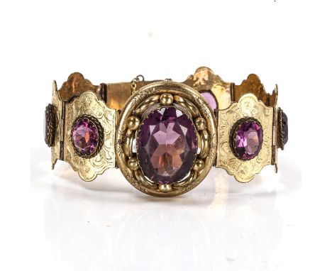 A Victorian gilt-metal amethyst panel bracelet, set with oval mixed-cut amethysts with engraved floral decoration, bracelet l