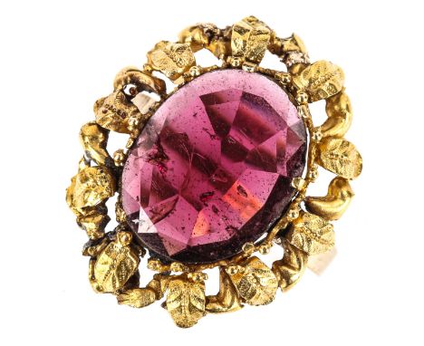 A large Antique flat top garnet ring, unmarked gold floral surround, setting height 25.2mm, size P, 4.4gRing has been re-purp