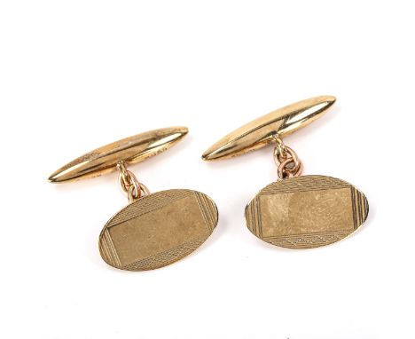 A pair of late 20th century 9ct gold oval cufflinks, engine turned decoration with bullet backings, hallmarks Birmingham 1987