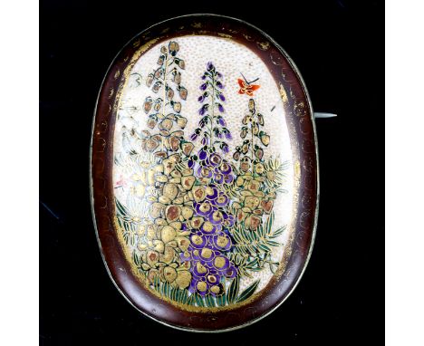 A Japanese Satsuma porcelain panel brooch, hand painted and gilded decoration, with white metal setting and maker's mark vers