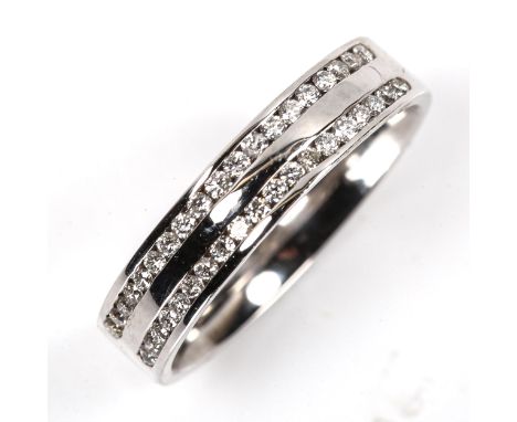 A modern 18ct gold diamond band ring, channel set with double-row of modern round brilliant-cut diamonds, total diamond conte