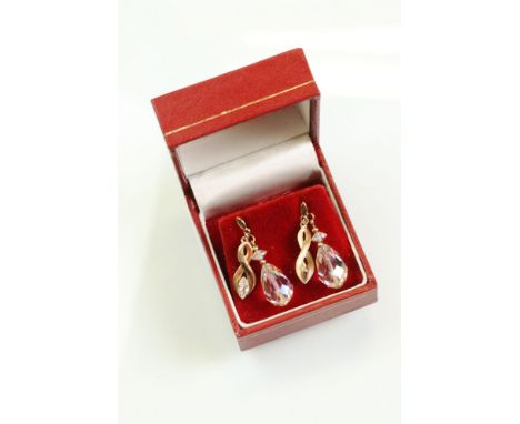 Pair of aurora borealis crystal 9ct yellow gold drop earrings, the briolette cut pear shaped crystal suspended from a squat c