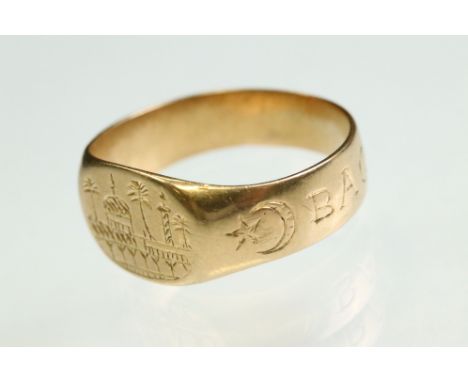Early 20th century Iraqi yellow metal signet ring, engraved building and tree design to the head, the shank engraved Baghdad 