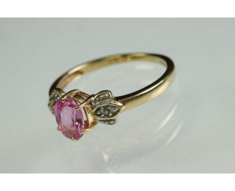 Pink sapphire and diamond 18ct yellow and white gold set ring, the oval mixed cut pink sapphire measuring approx 6.5mm x 8.5,