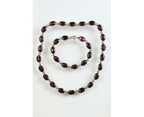 Paste riviere white metal necklace, alternating oval purple paste and round colourless paste, rubover set with millegrain edg