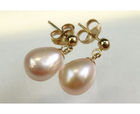 Pair of cultured pearl 9ct yellow gold drop earrings, the pale pink elliptical pearl measuring approx 9.5mm x 8mm, post and b