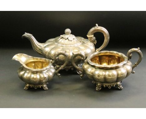 William IV three piece silver tea service comprising teapot, milk jug and sugar bowl, the squat melon-shaped bodies each rais