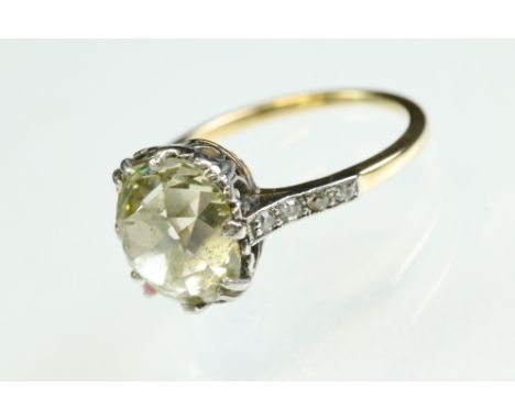 Pale yellow diamond unmarked yellow gold and platinum set ring, the cushion cut diamond weighing approx 3.45 carats (dimensio