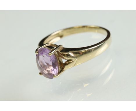 Amethyst 9ct yellow gold ring, the oval mixed cut amethyst measuring approx 9mm x 7mm, claw set, ring size N½ 