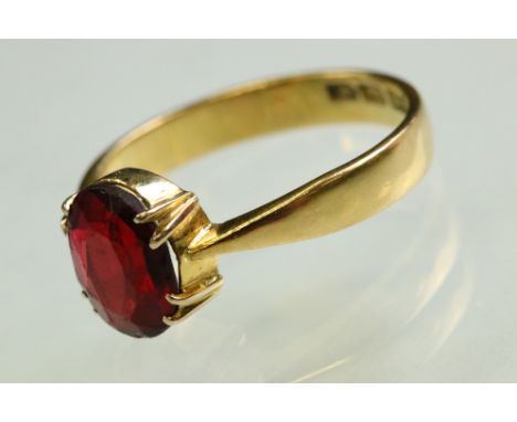 Garnet topped doublet 22ct yellow gold ring, the oval mixed cut doublet measuring approx 9.5mm x 7.5mm, claw setting, tapered