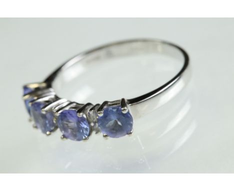 Tanzanite and diamond 14ct white gold ring, four round mixed cut tanzanite, diameter approx 4.5mm, small round brilliant cut 