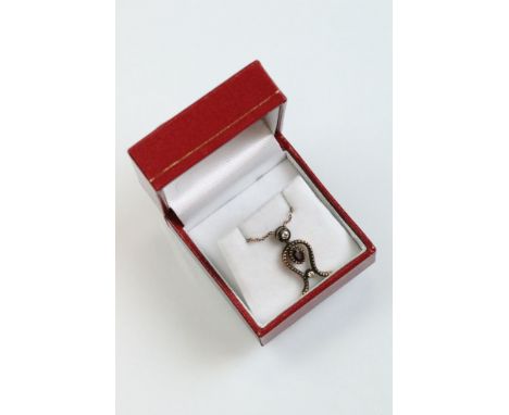 Ruby and diamond 8ct rose gold silver set pendant necklace, the centre oval mixed cut ruby measuring approx 5mm x 3mm, rubove