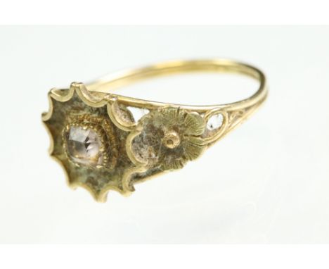 19th century quartz yellow metal ring, the square step cut quartz measuring approx 3mm x 3mm, rubover set, closed back settin