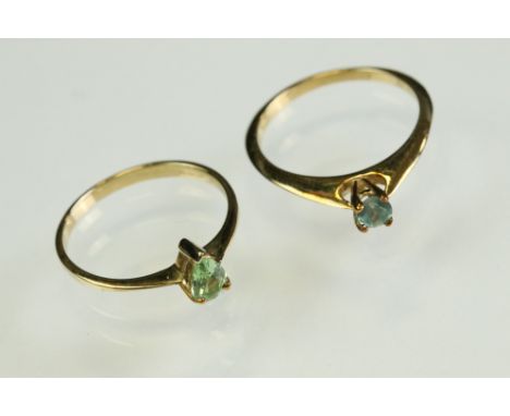 Emerald 9ct yellow gold ring, the round mixed cut pale emerald diameter approx 3.5mm, claw set, tapered shoulders, N½; togeth