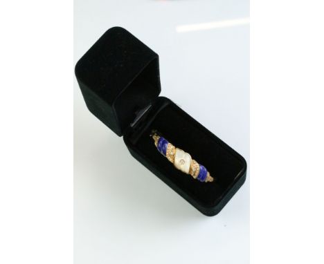 Mother-of-pearl, lapis lazuli and diamond 18ct yellow gold hinged bangle, carved mother-of-pearl to the centre set with a sma