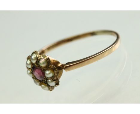 Victorian garnet and pearl 9ct rose gold flower head ring,  pink-purple round mixed cut garnet to the centre, diameter approx