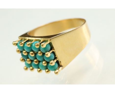 Turquoise yellow gold ring, twelve small round cabochon cut turquoise stones, shared prong and bead settings, tapered shoulde