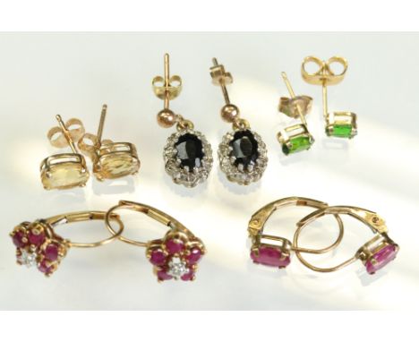 Five pairs of gem set earrings to include a pair of green tourmaline 14ct yellow gold stud earrings; a pair of sapphire 9ct y