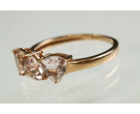 Gemset 9ct rose gold ring, three trillion cut pale pink stones, possibly pink kunzite, claw set, ring size S 