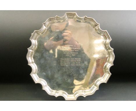 Silver salver raised on three hoof feet, presentation inscription, Chippendale border, makers Josiah Williams &amp; Co, Londo