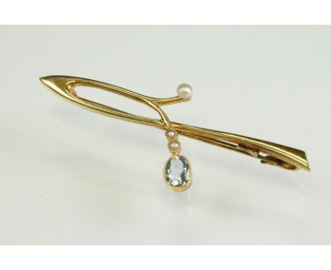 Early 20th century aquamarine and seed pearl 15ct yellow gold brooch, the oval mixed cut aquamarine measuring approx 6mm x 4m