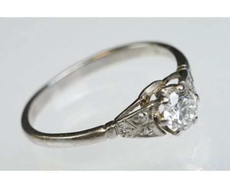 Diamond solitaire white metal ring, the round brilliant cut diamond weighing approx 0.50 carat, assessed clarity VS, six claw